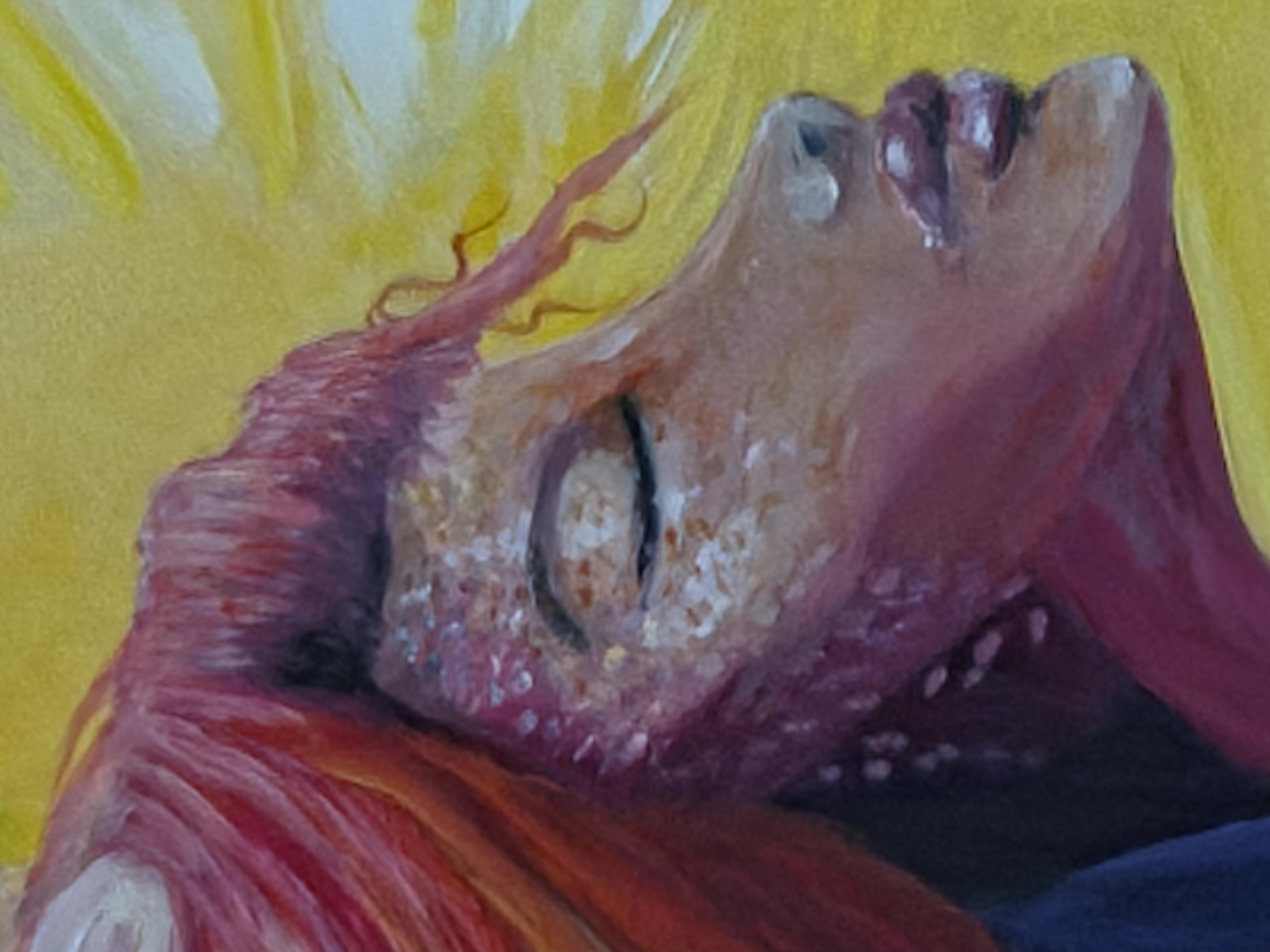 Close detail of an oil painted face with yellow light and red hair.